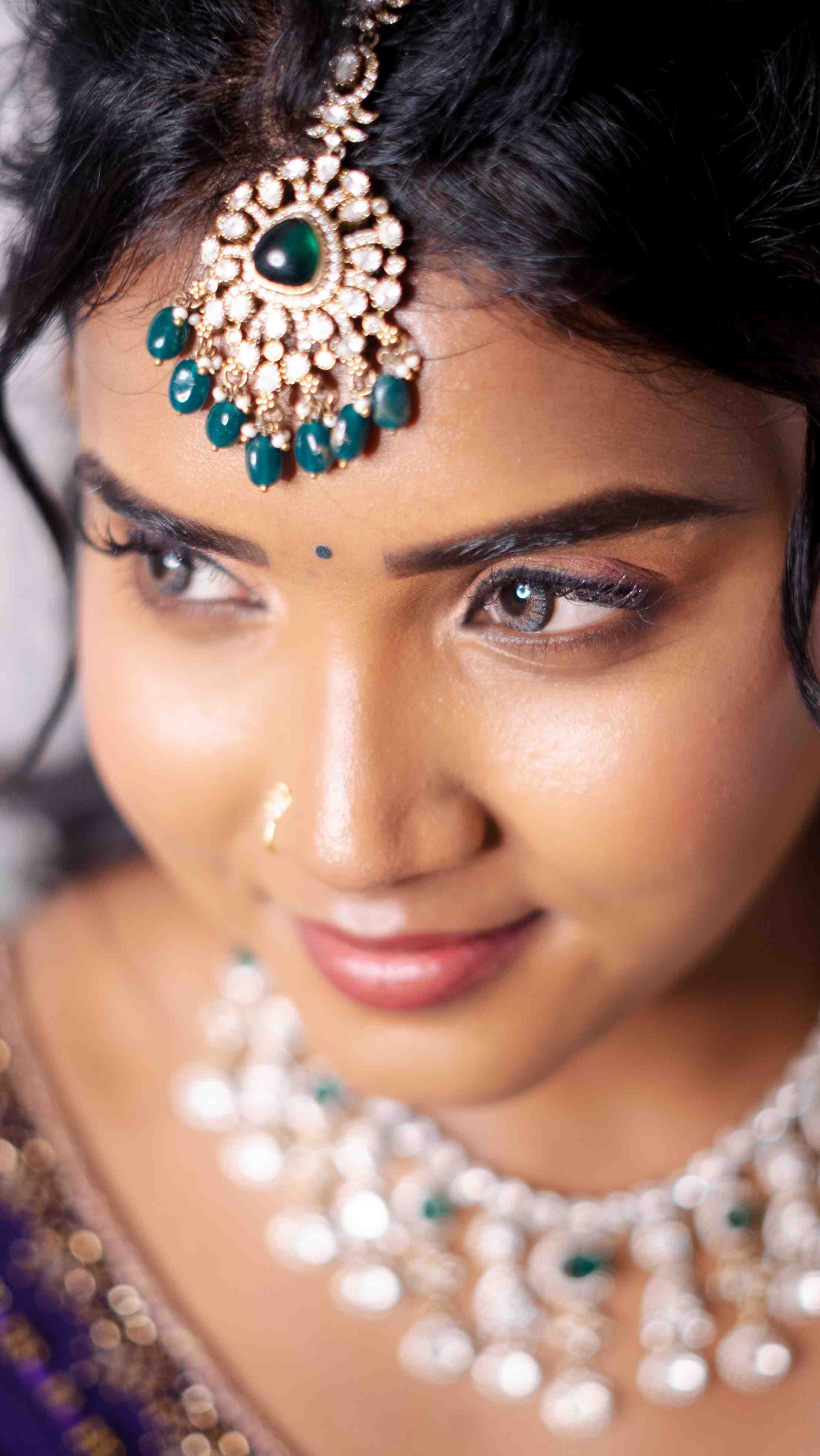 Bridal makeup application at Page 3 Luxury Salon Madurai