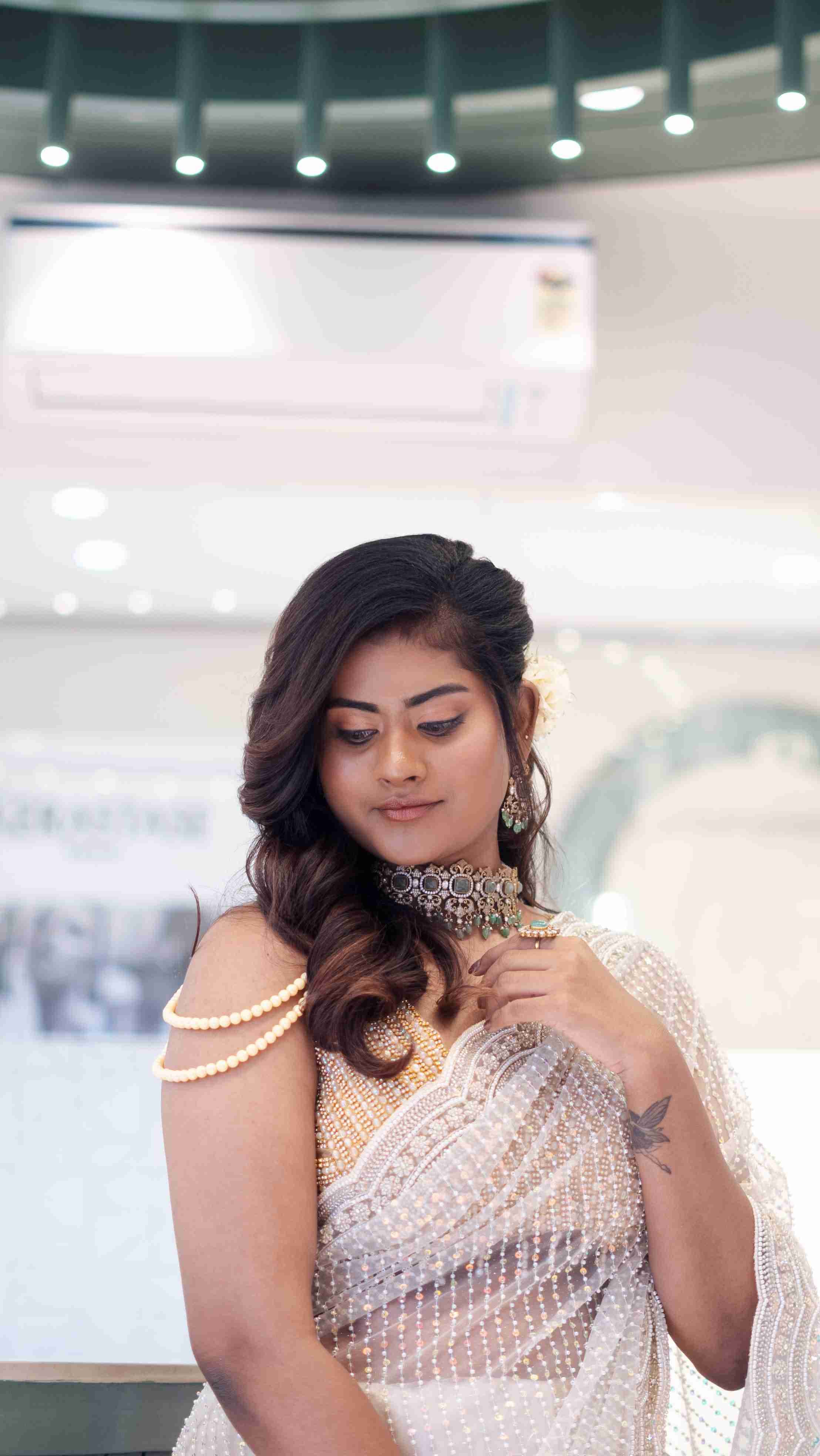 Soft curled hairstyle finished at Page 3 Luxury Salon Madurai