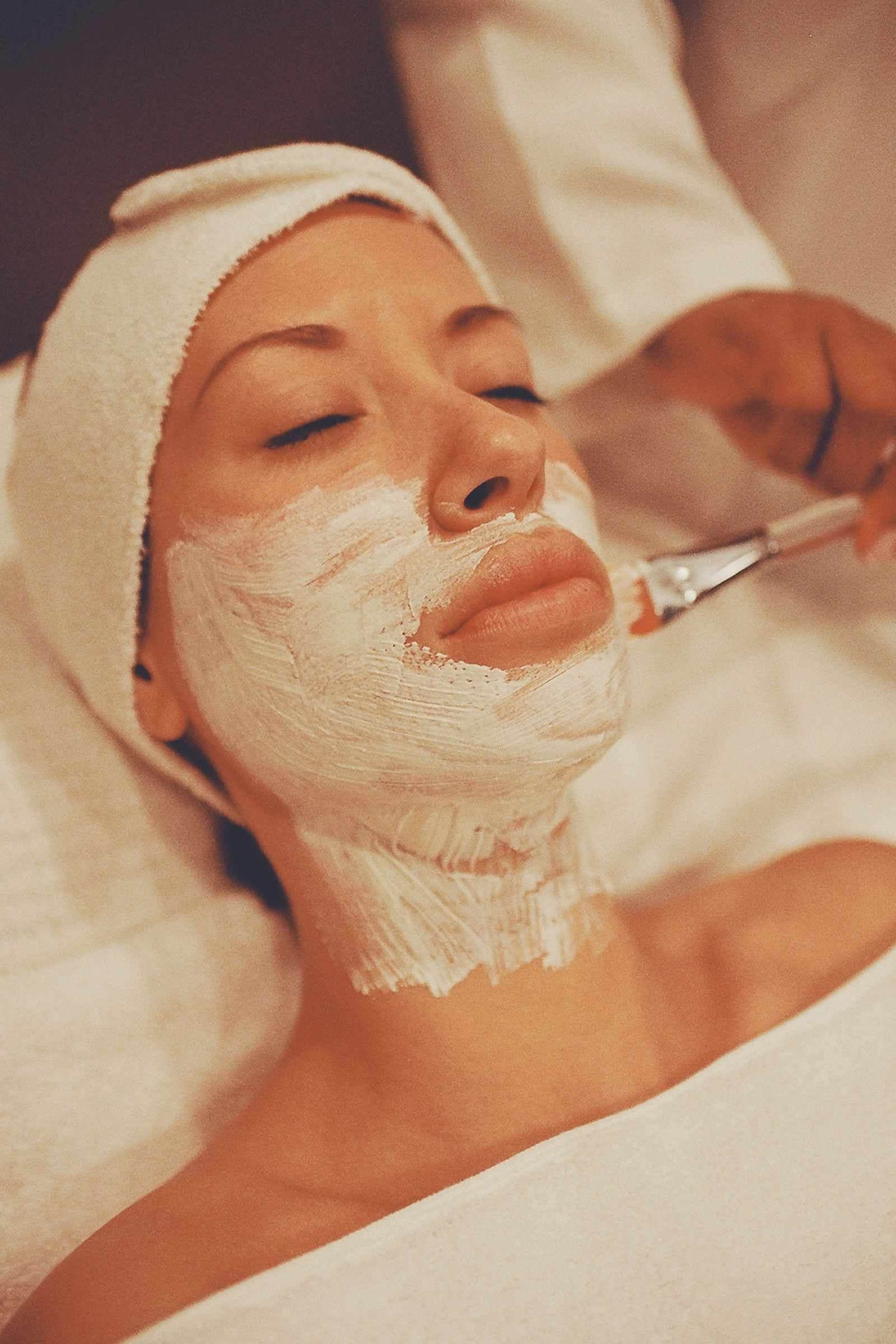 Skin therapist performing a brightening facial treatment at Page 3 Luxury Salon Madurai
